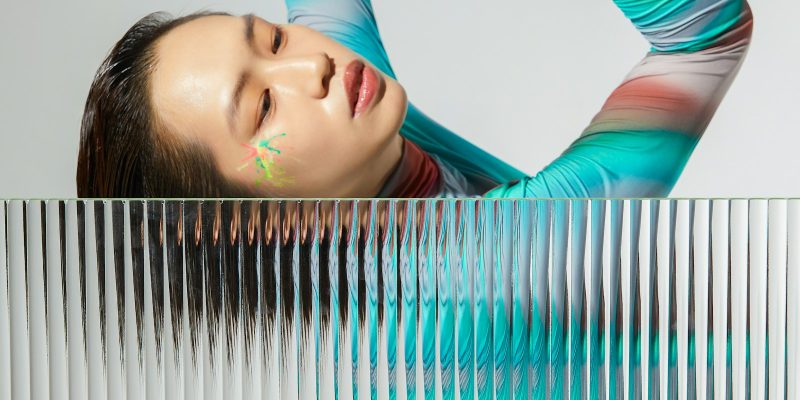 An abstract, fragmented image of a dancer's pose, representing the concept musical format